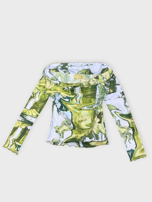 Abstract print long sleeve top in green with a frayed hem front view.