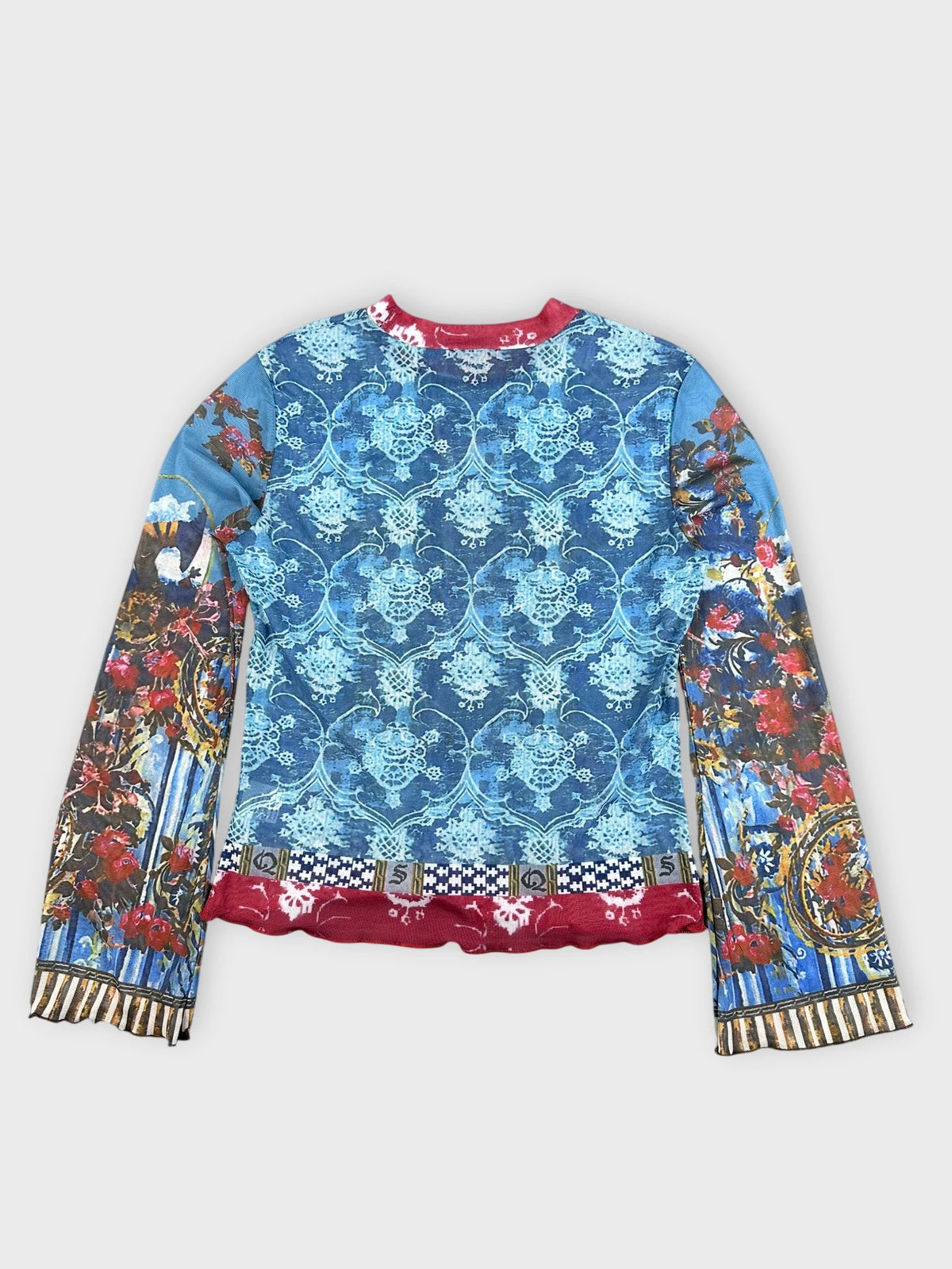Back view of blue mesh top featuring baroque print and red trim.