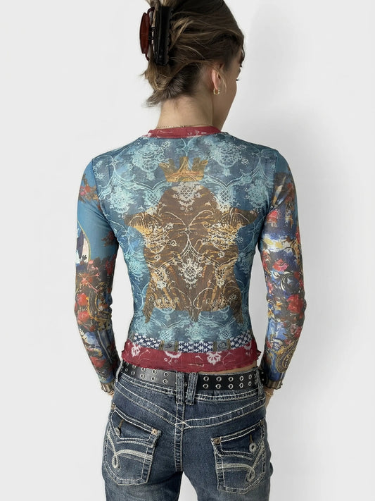 Back view of a mesh top in blue with intricate baroque crown print.