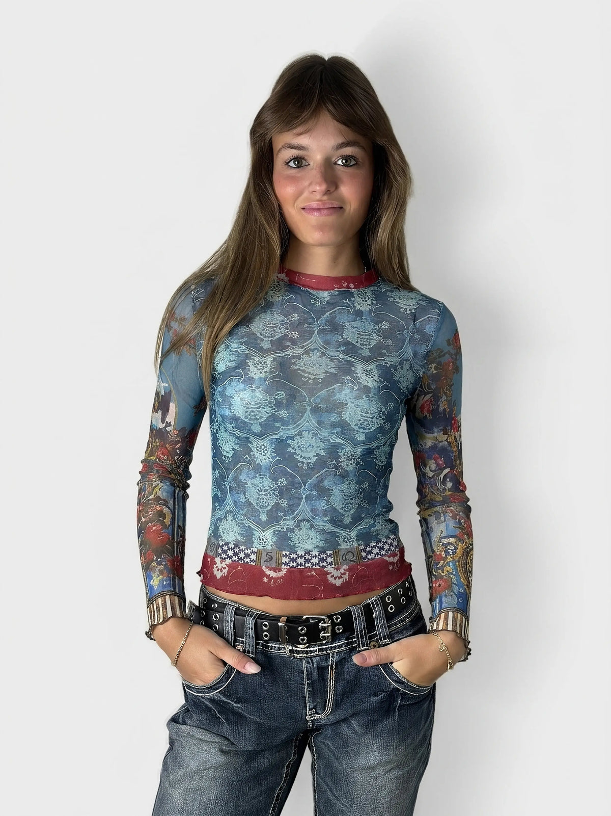Front view of a blue mesh long-sleeve top featuring a floral pattern.