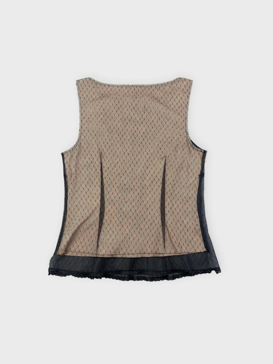 Back view of a mesh top in beige featuring pleats and lace trim.