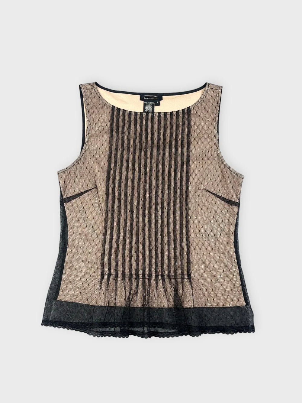Front view of a beige mesh top with pleats and black trim.