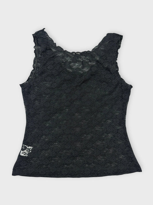 Back view of black lace top featuring floral details and scalloped trim.
