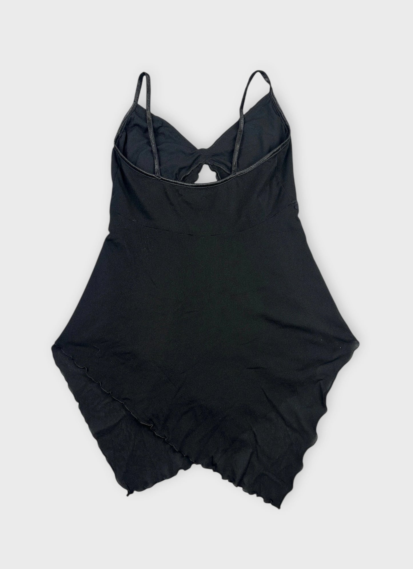 Back view of a black sheer cami top with lace trim.