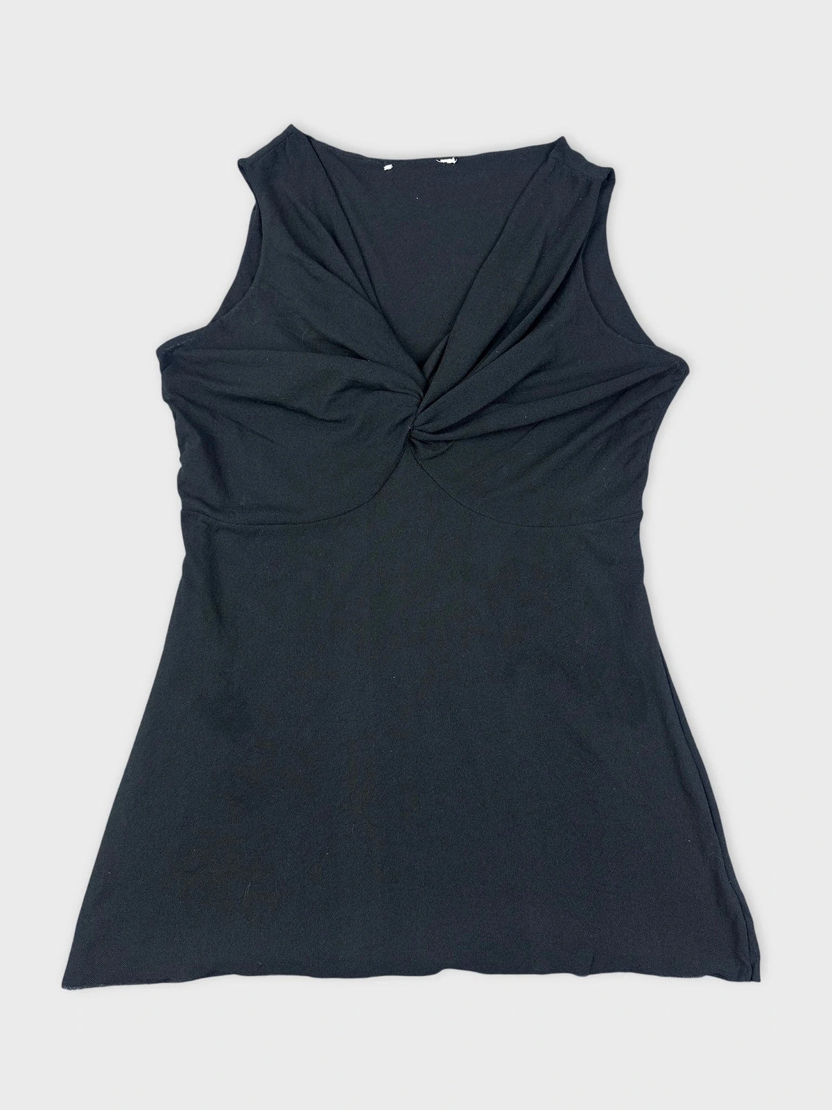 Black sleeveless top with twist detail, detail view.
