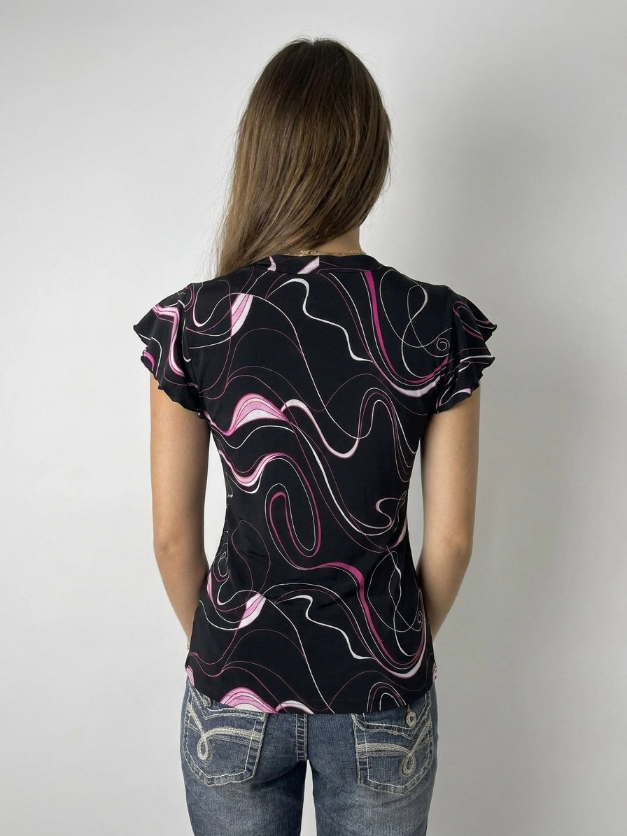 Back view of black swirl print top with ruffled sleeves.