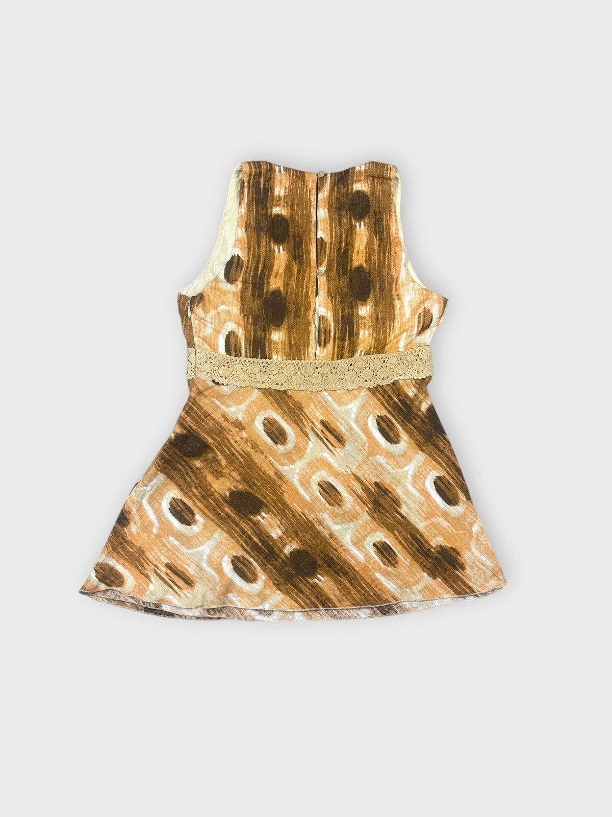 Back view of a brown boho wrap top featuring lace detail and a patterned design.