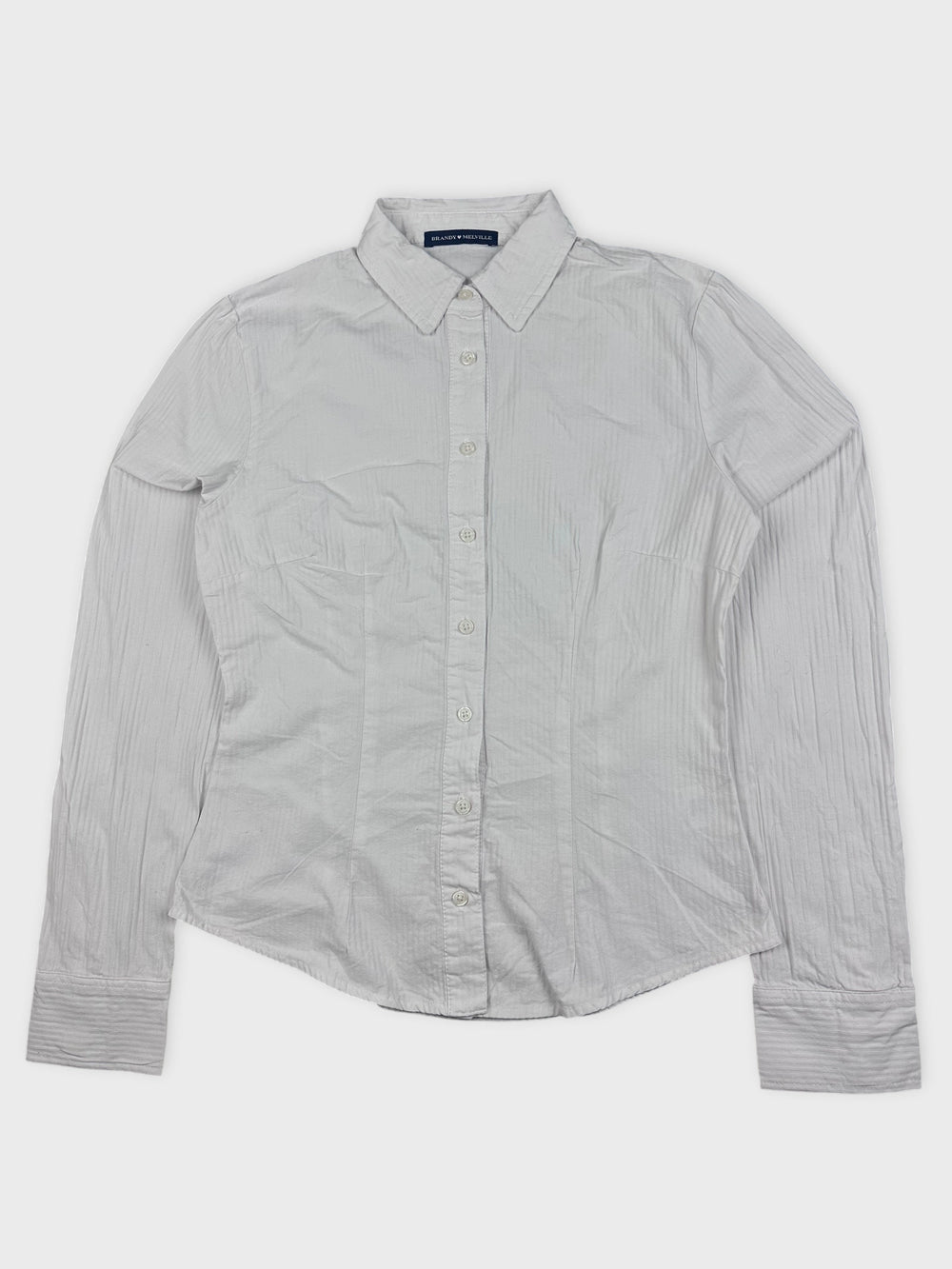 Front view of a white button-down shirt with subtle stripes.