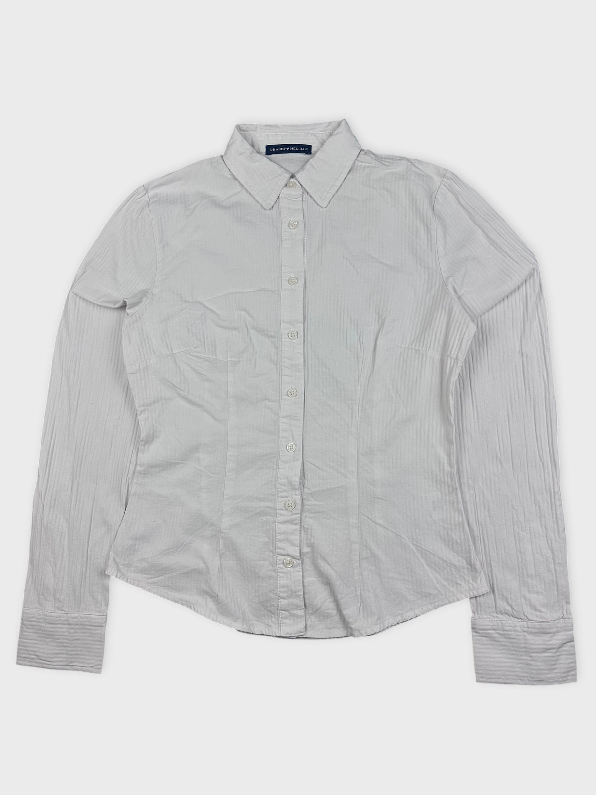 Front view of a white button-down shirt with subtle stripes.