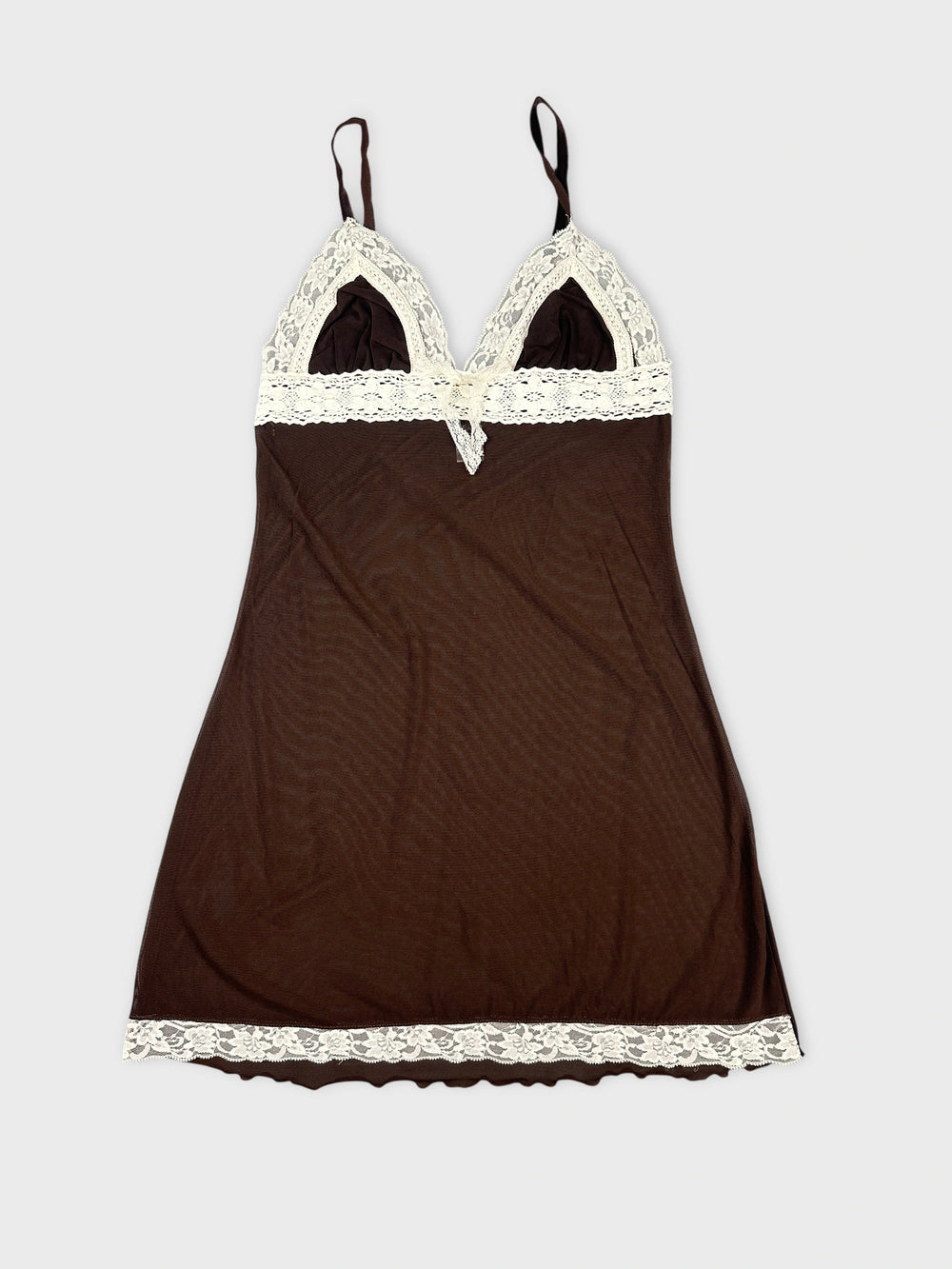 Front view of brown mesh crop top with lace detail and adjustable straps