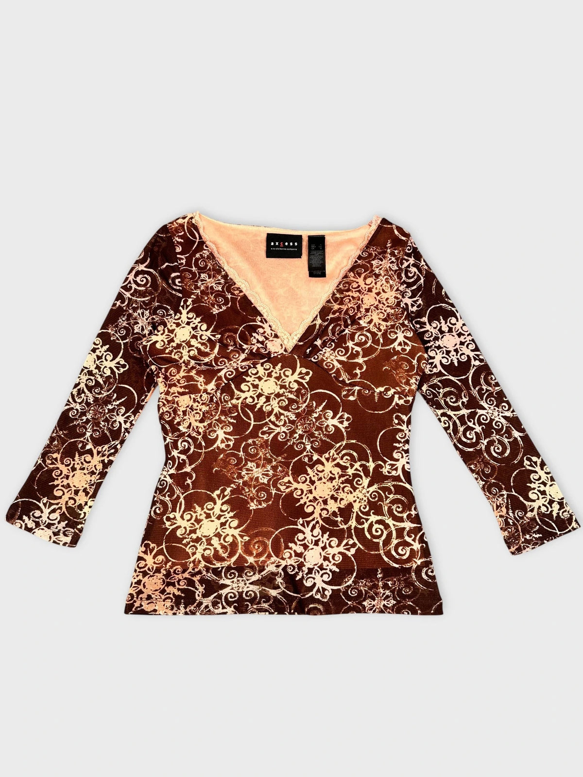 Front view of brown sheer long sleeve top with floral print.