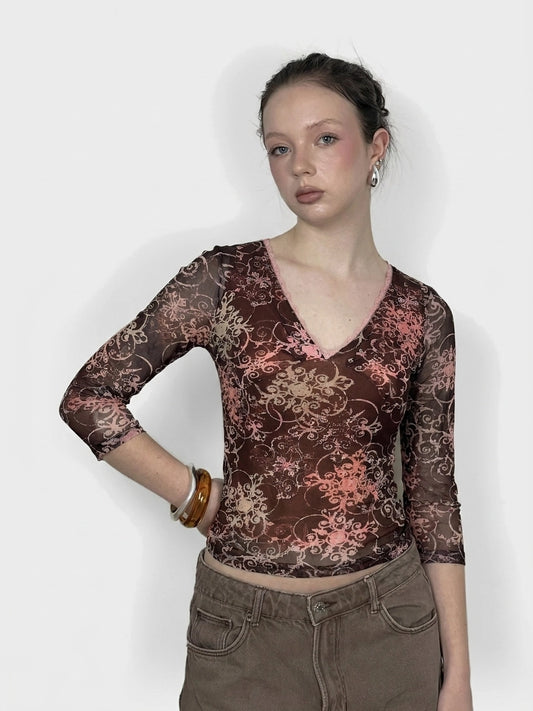Brown sheer long sleeve top with floral print, front view.