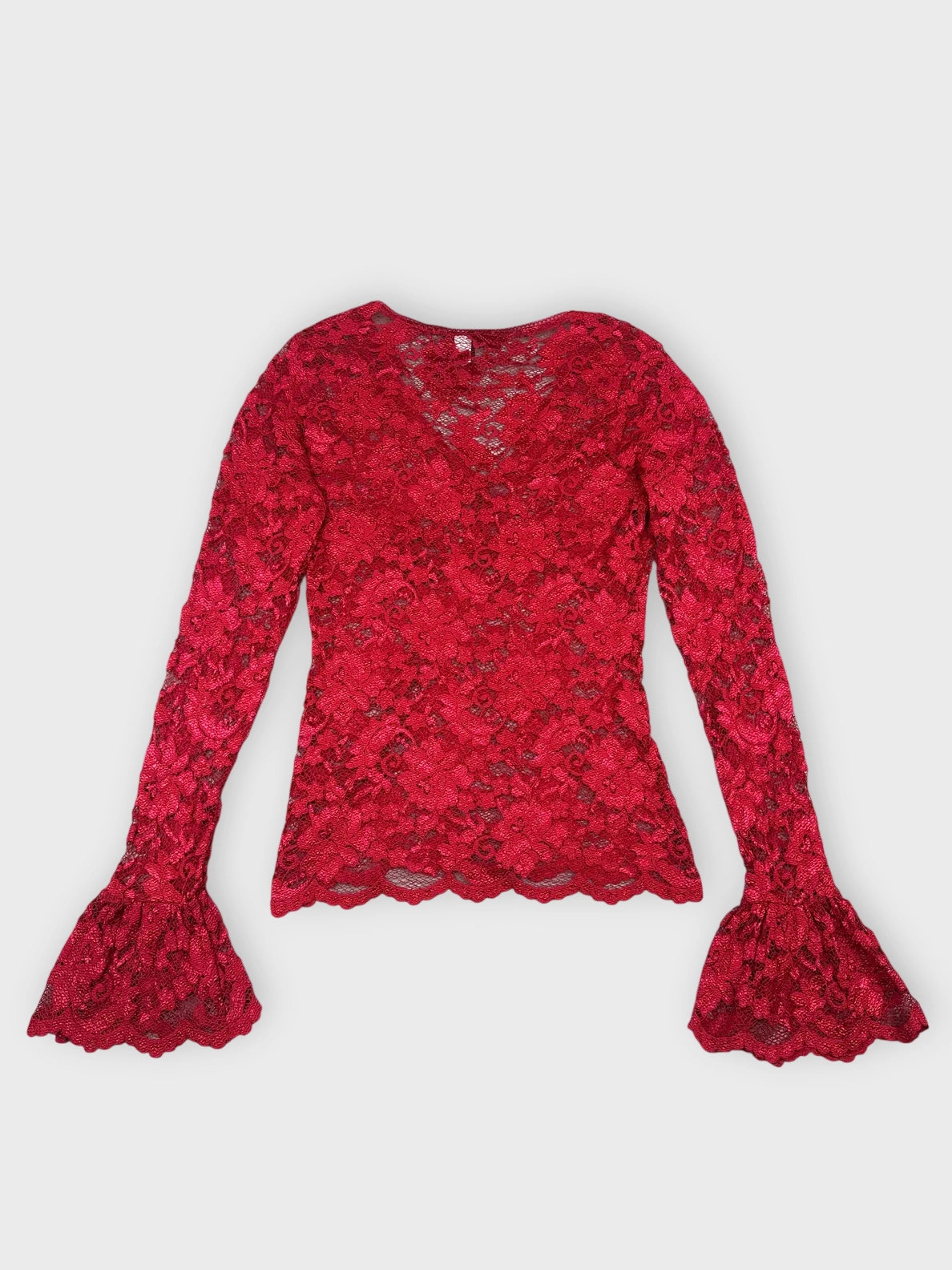 Back view of a burgundy lace blouse with flared sleeves.