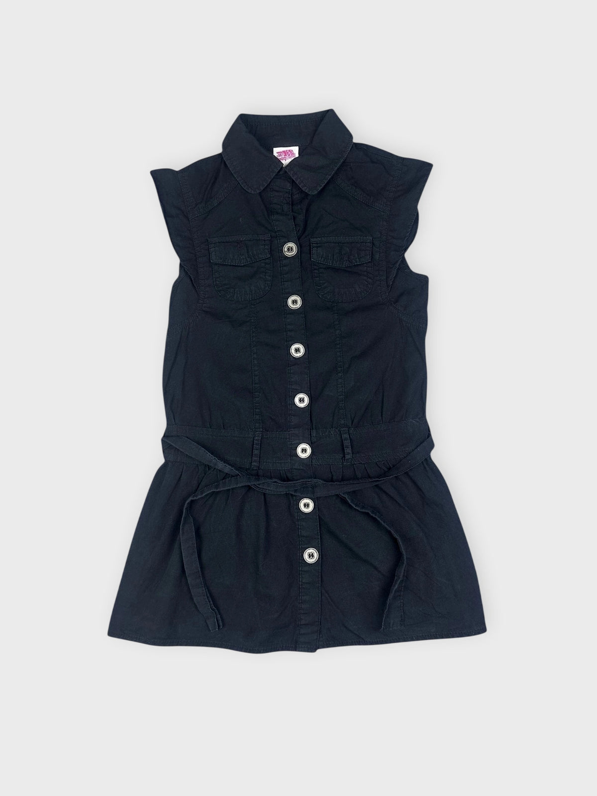 Detail view of a black button-down top with a fitted waist and short sleeves.