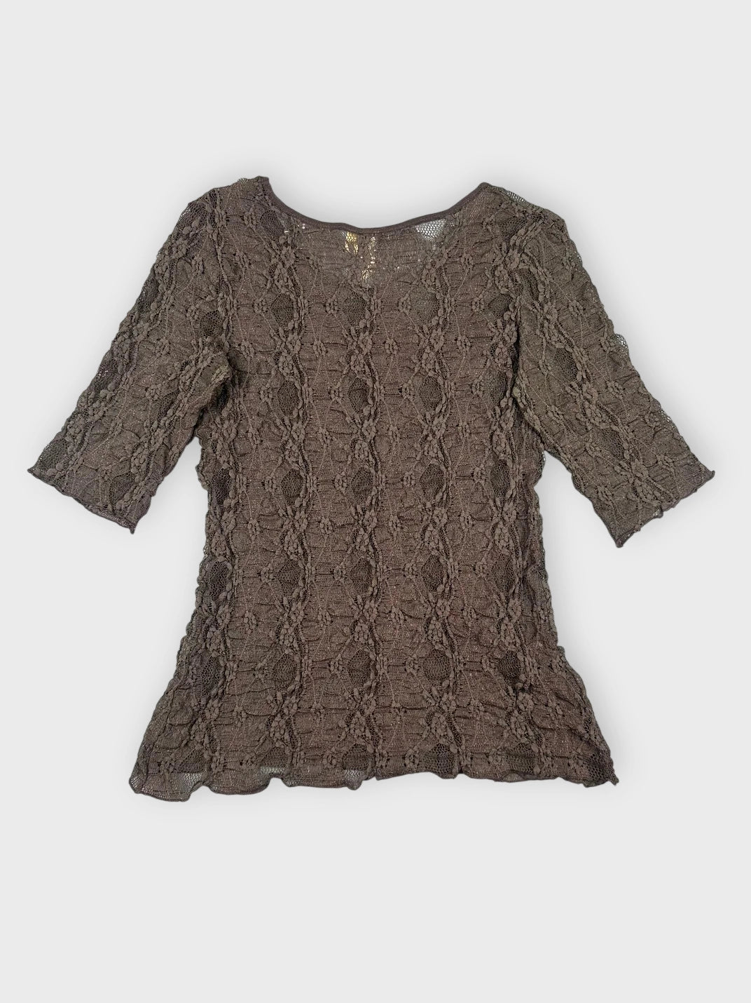 Chic black lace top back view featuring a detailed crochet pattern.