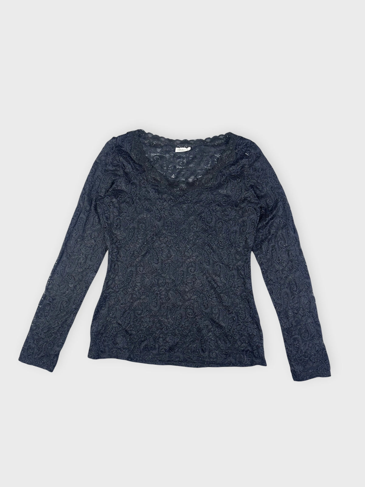 detail view of a black lace long sleeve top with paisley pattern