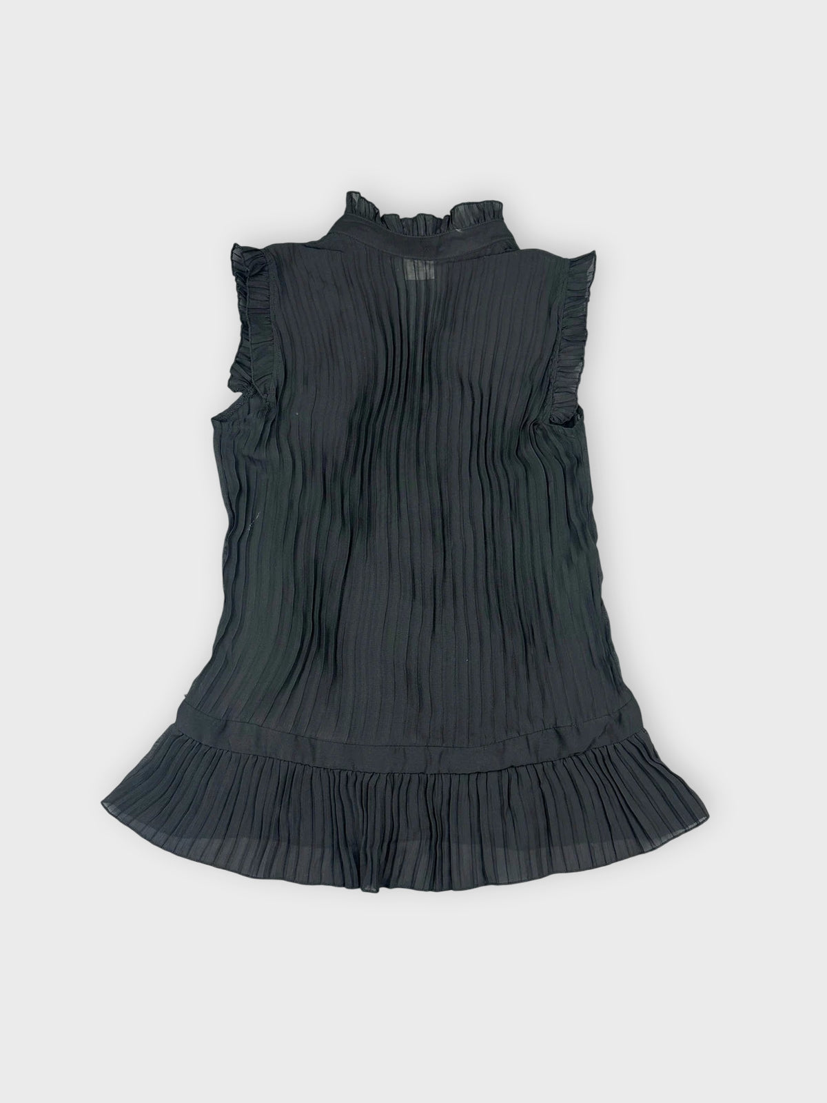 Back view of a chic black ruffled button-up top with pleated texture.
