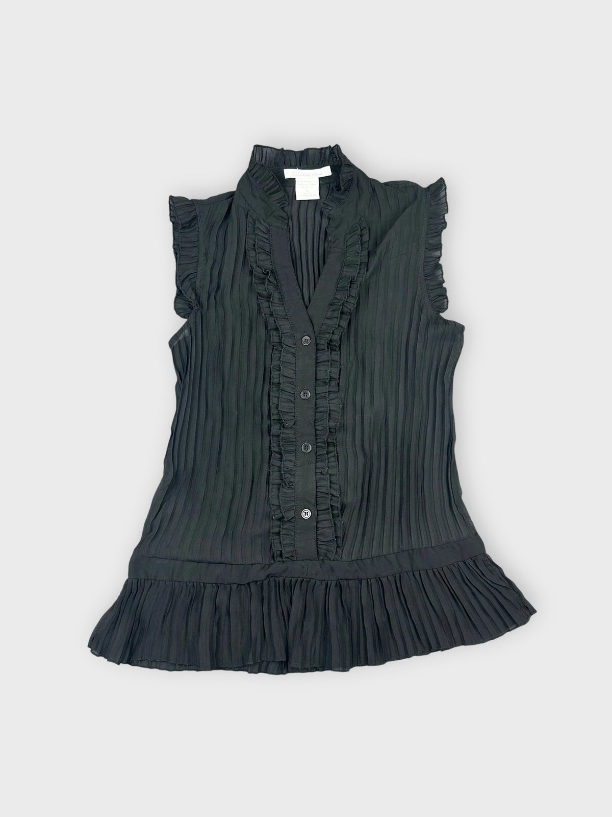 Front view of a black ruffled button-up top with pleated details.