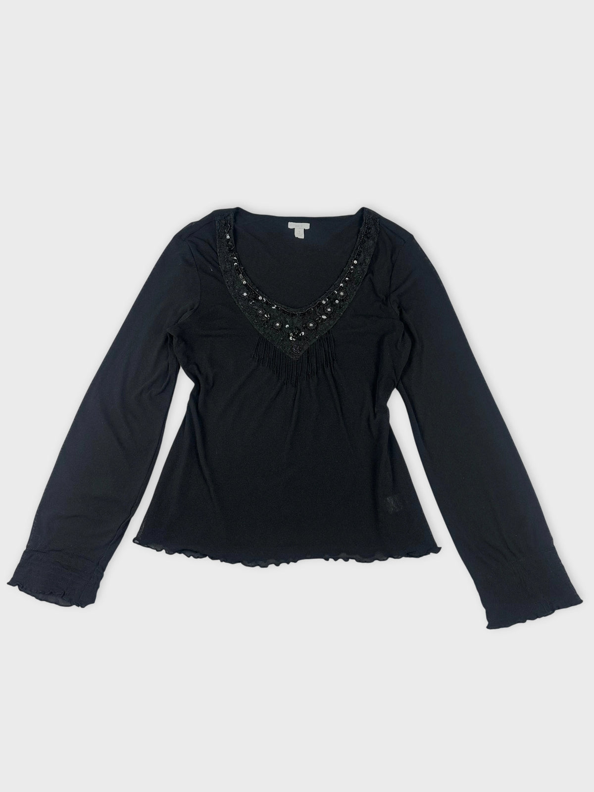 Chic black sheer top with embellished detail front view