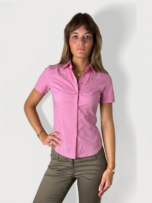 Front view of a pink cotton top featuring buttons and short sleeves.