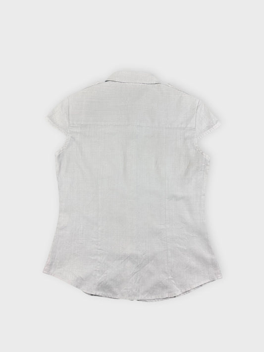 Chic light beige button-up top back view with short sleeves and collar.