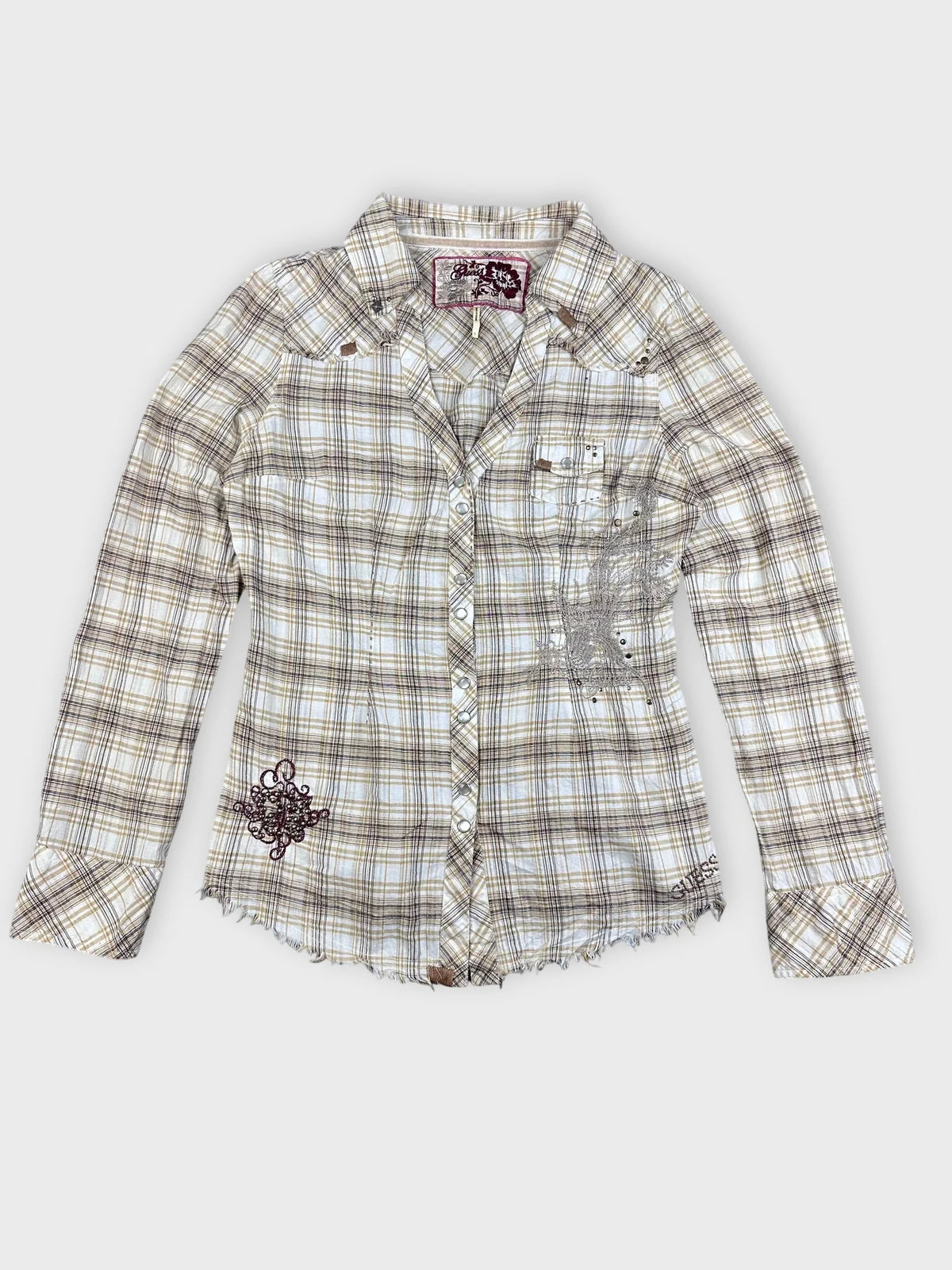 Front view of a plaid button-up shirt in beige and yellow with frayed hem.