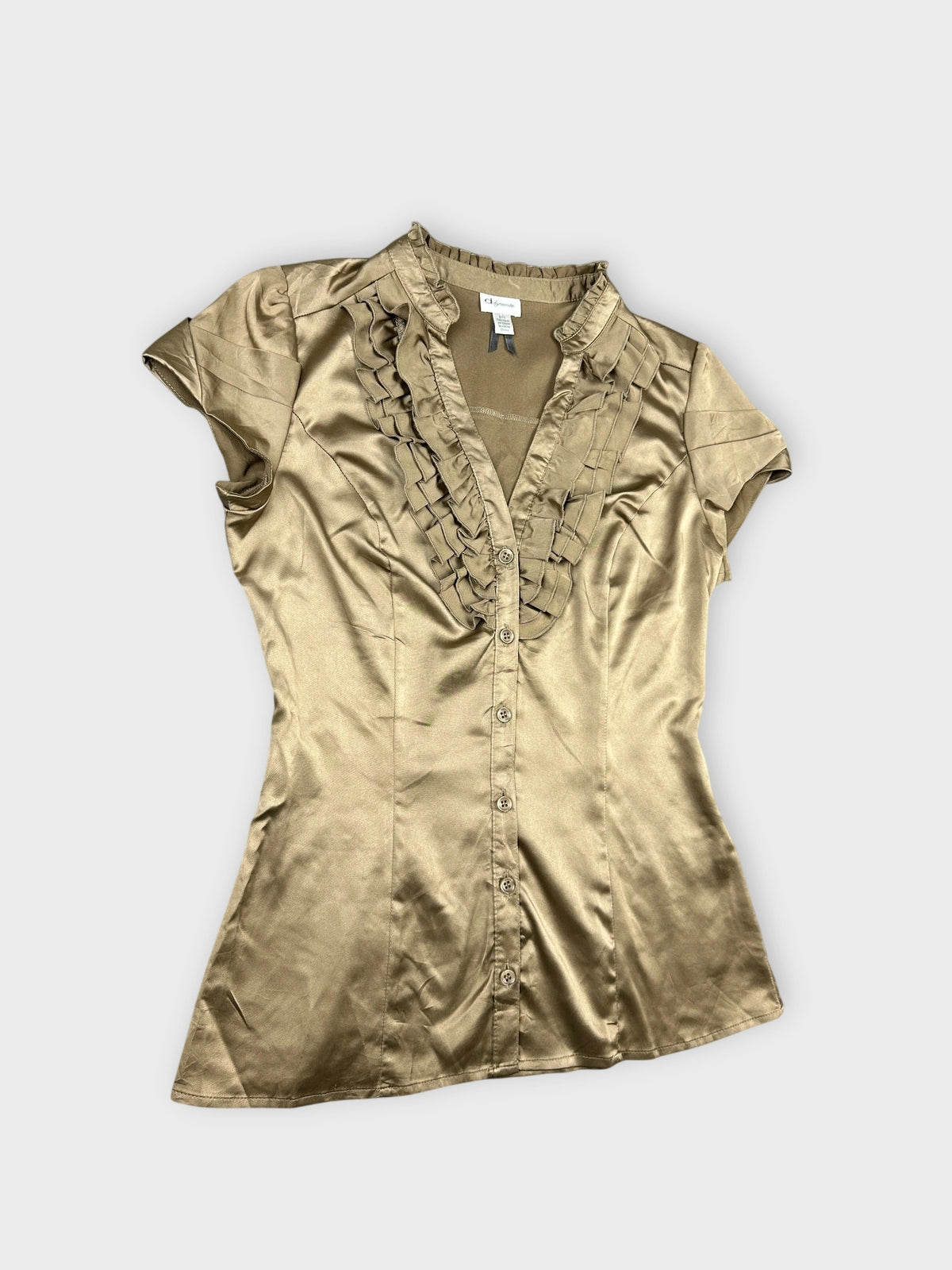 Detail view of taupe satin blouse with ruffled trim along the button placket.