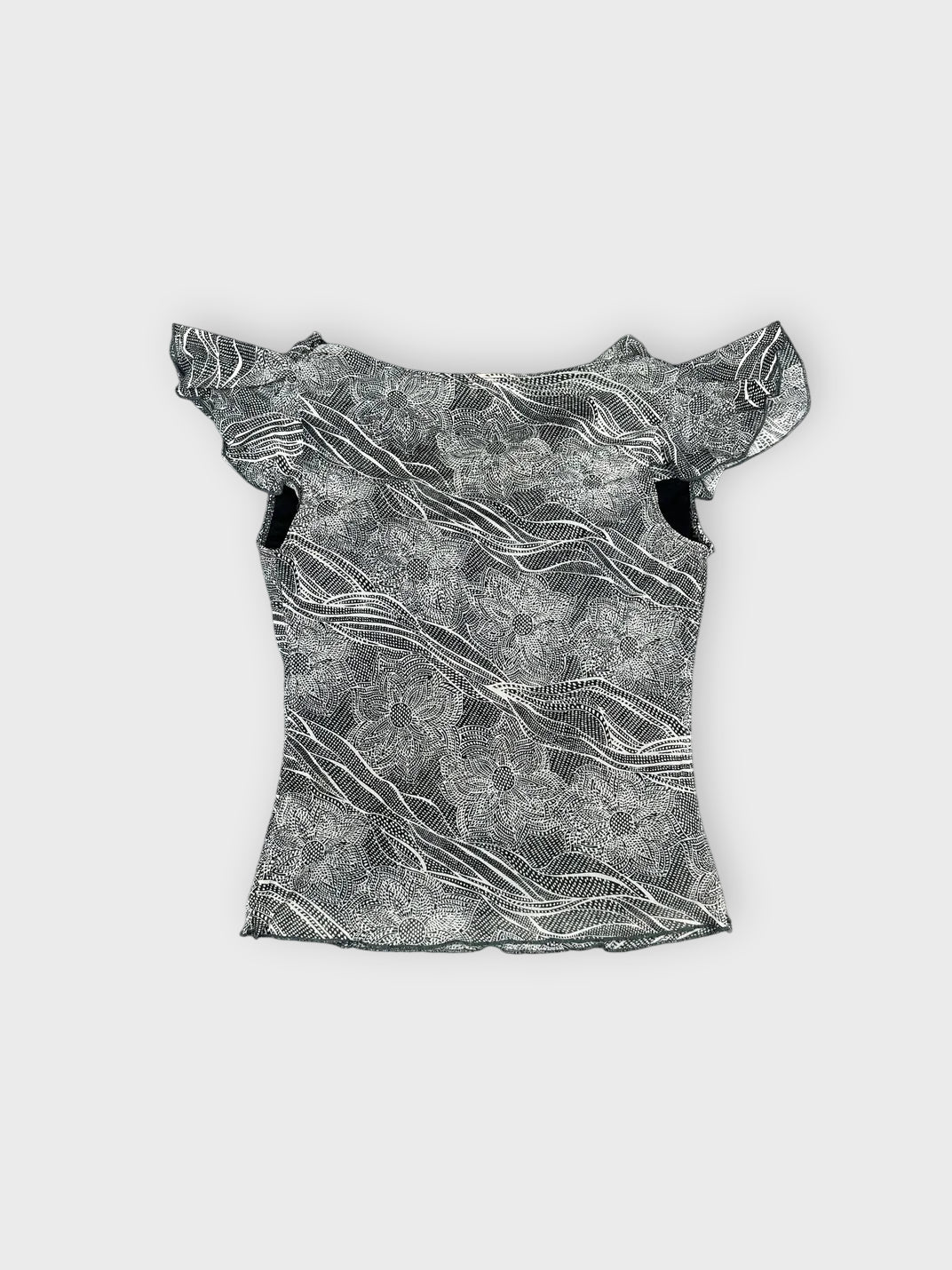 Back view of a gray short sleeve top with ruffled sleeves and wave pattern.