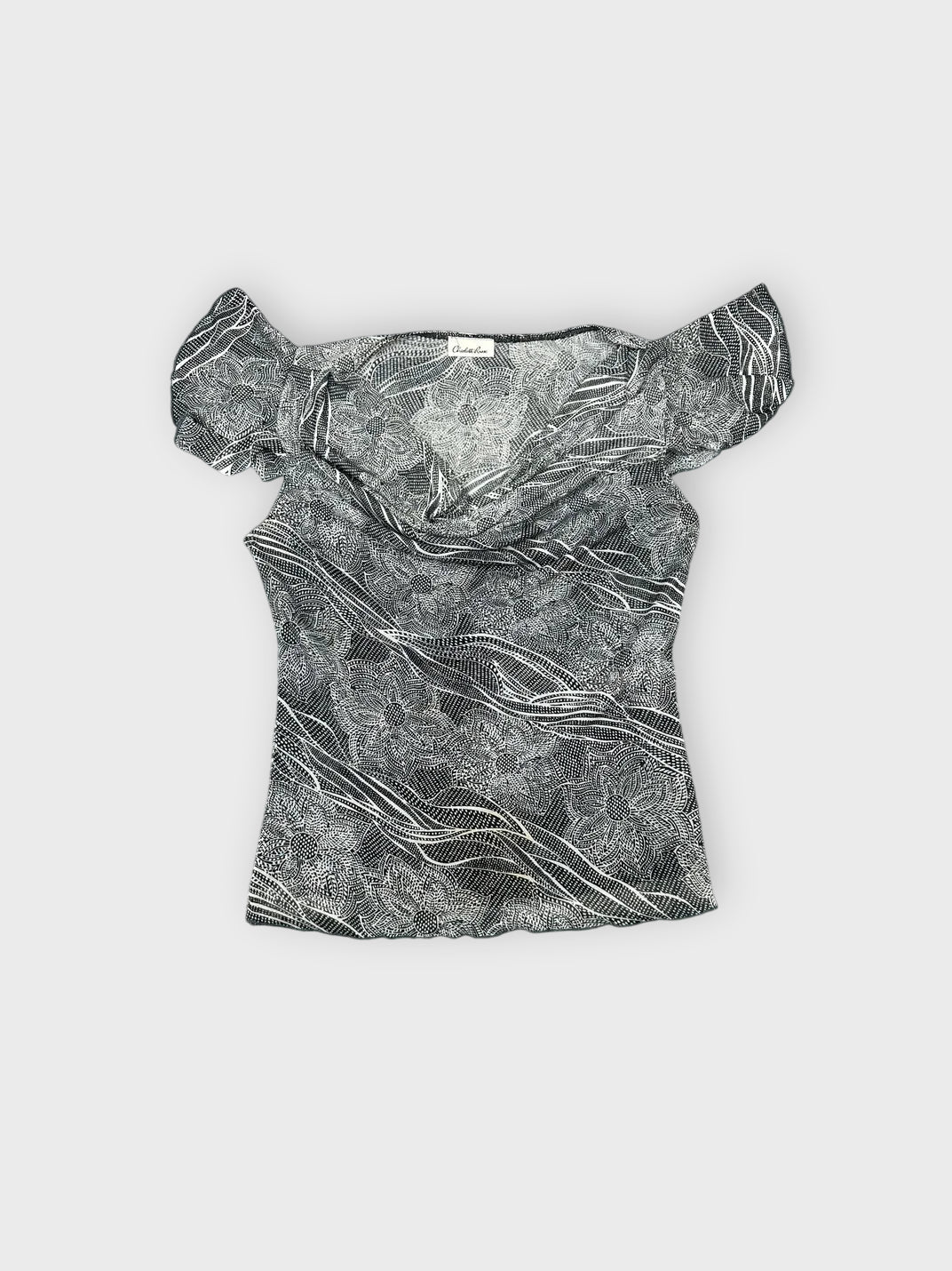 Front view of a gray short sleeve top featuring a flowing wave pattern.