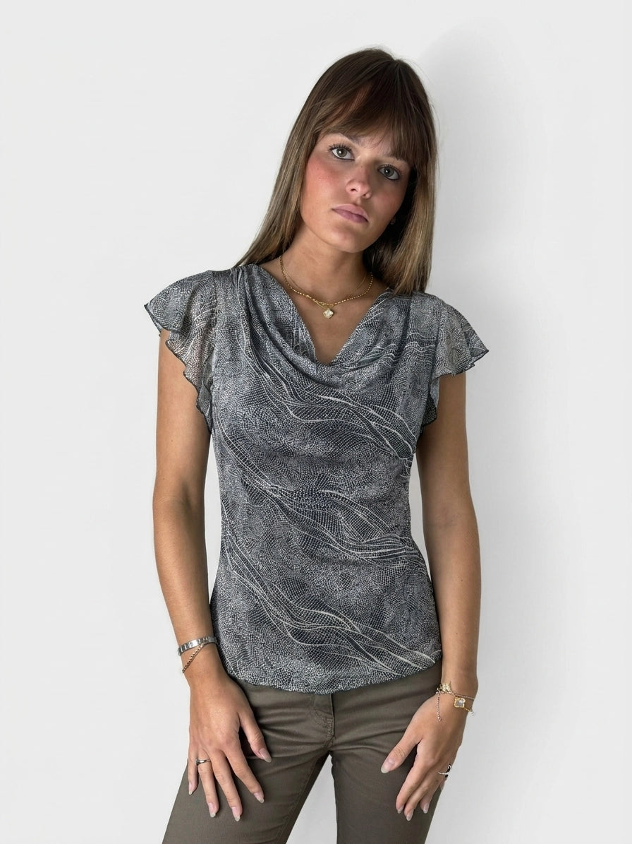 Chic short sleeve top in gray with flowing wave pattern, front view.