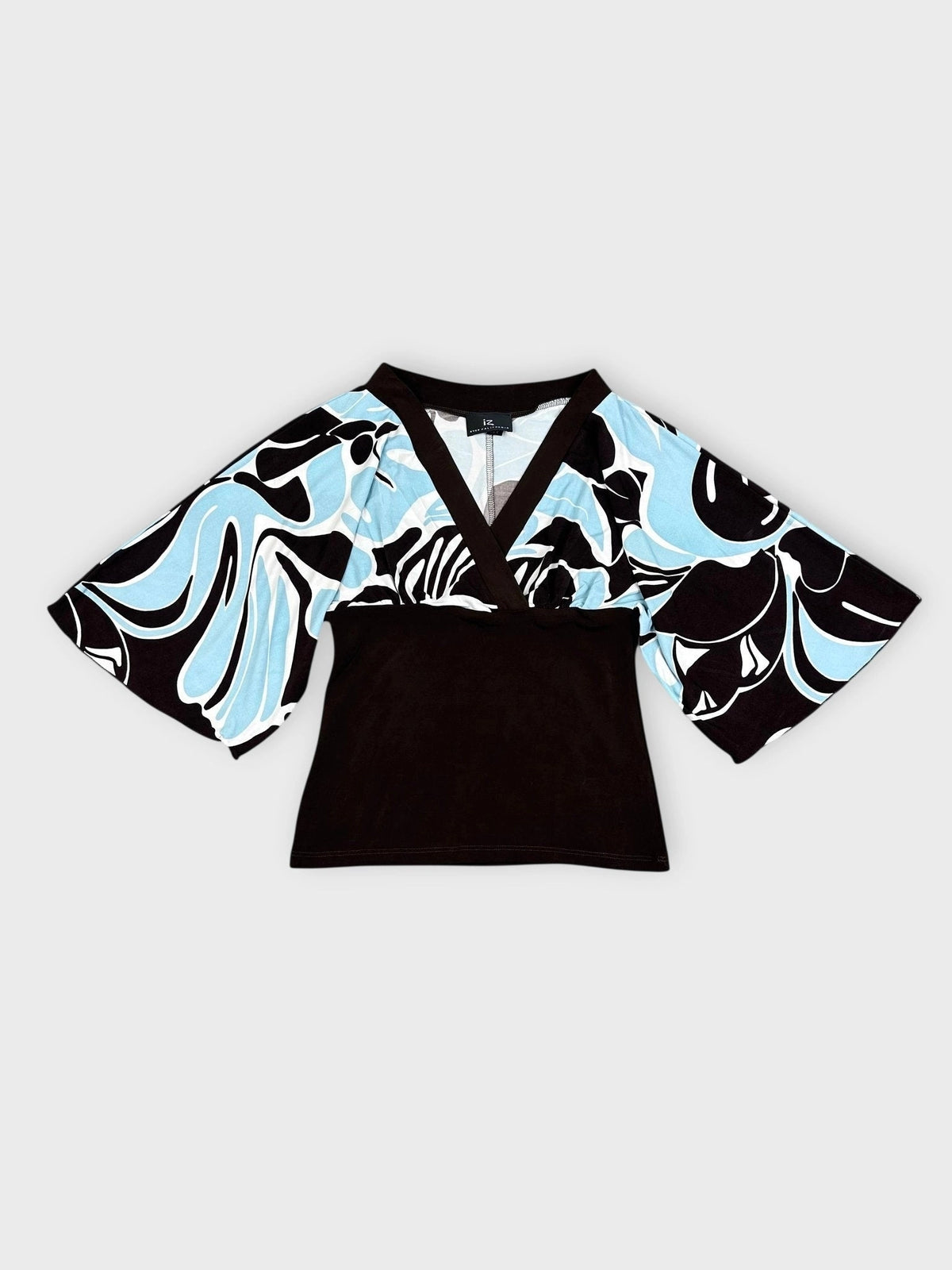 Front view of a kimono top featuring a black and blue swirl print.