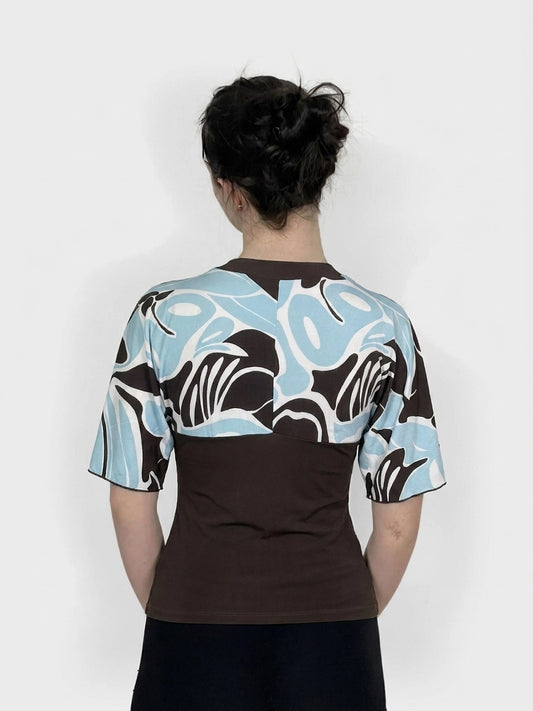 Back view of a kimono top in brown and light blue swirl print.