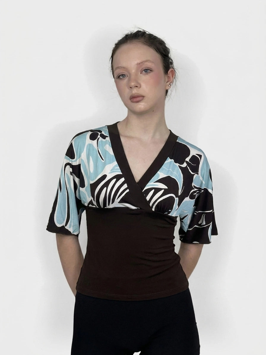 Brown and blue kimono top with swirl pattern, front view, featuring a wrap design.