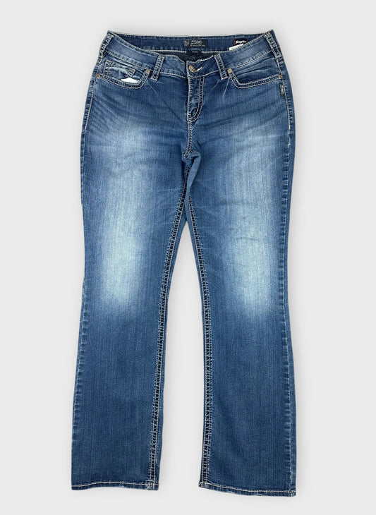 Front view of cool blue denim jeans featuring a slight flare design.