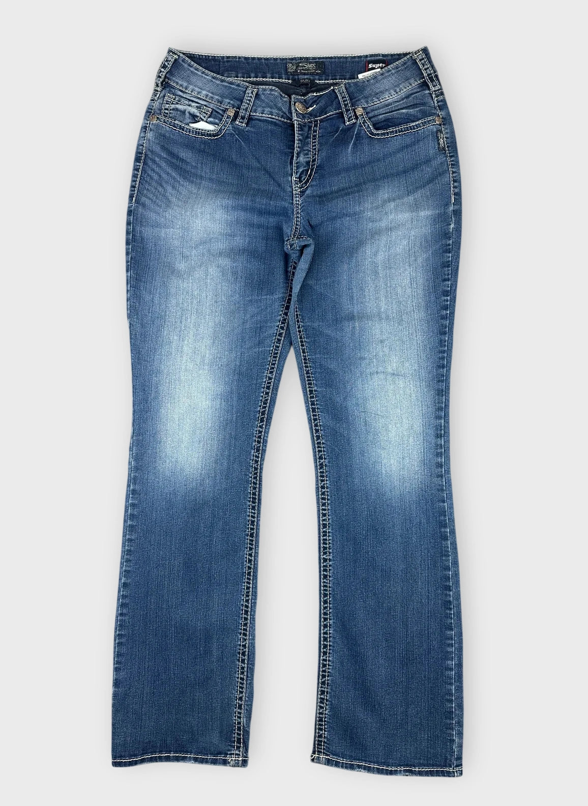 Front view of cool blue denim jeans featuring a slight flare design.