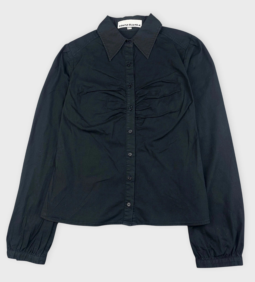Front view of a black ruched button-up shirt with a classic collar.