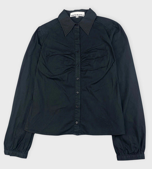 Front view of a black ruched button-up shirt with a classic collar.