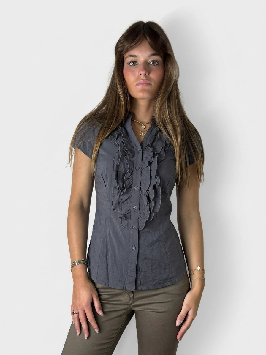 Dark gray button-up shirt with ruffled detail, front view.