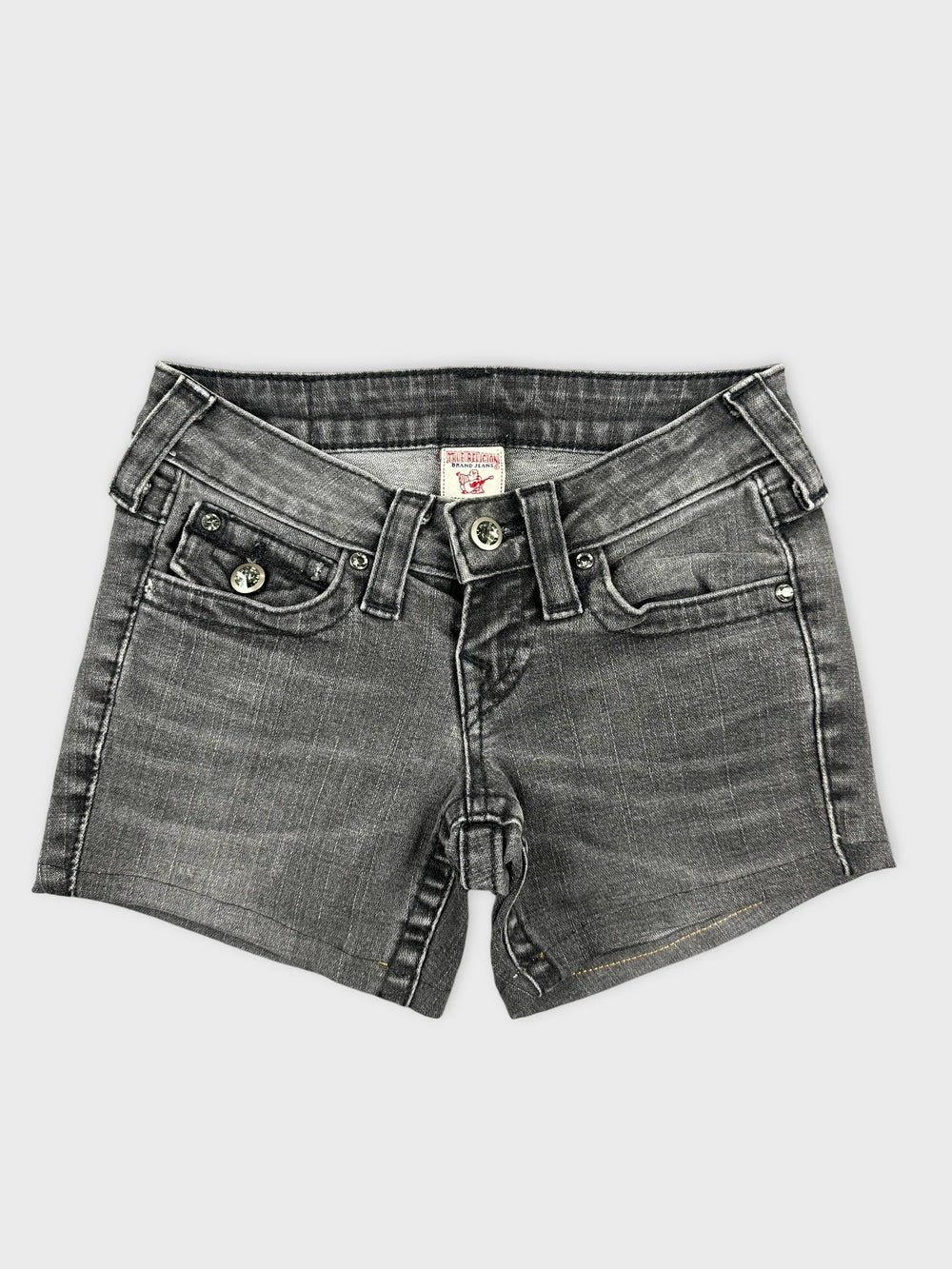 Front view of edgy black denim shorts featuring unique details and subtle wash.