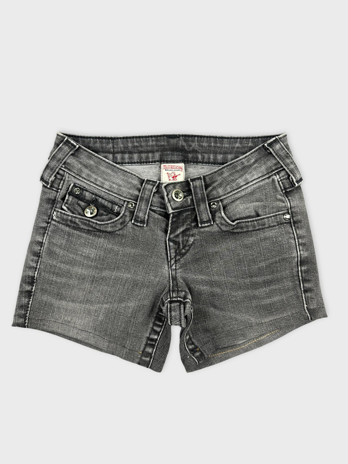 Front view of edgy black denim shorts featuring unique details and subtle wash.