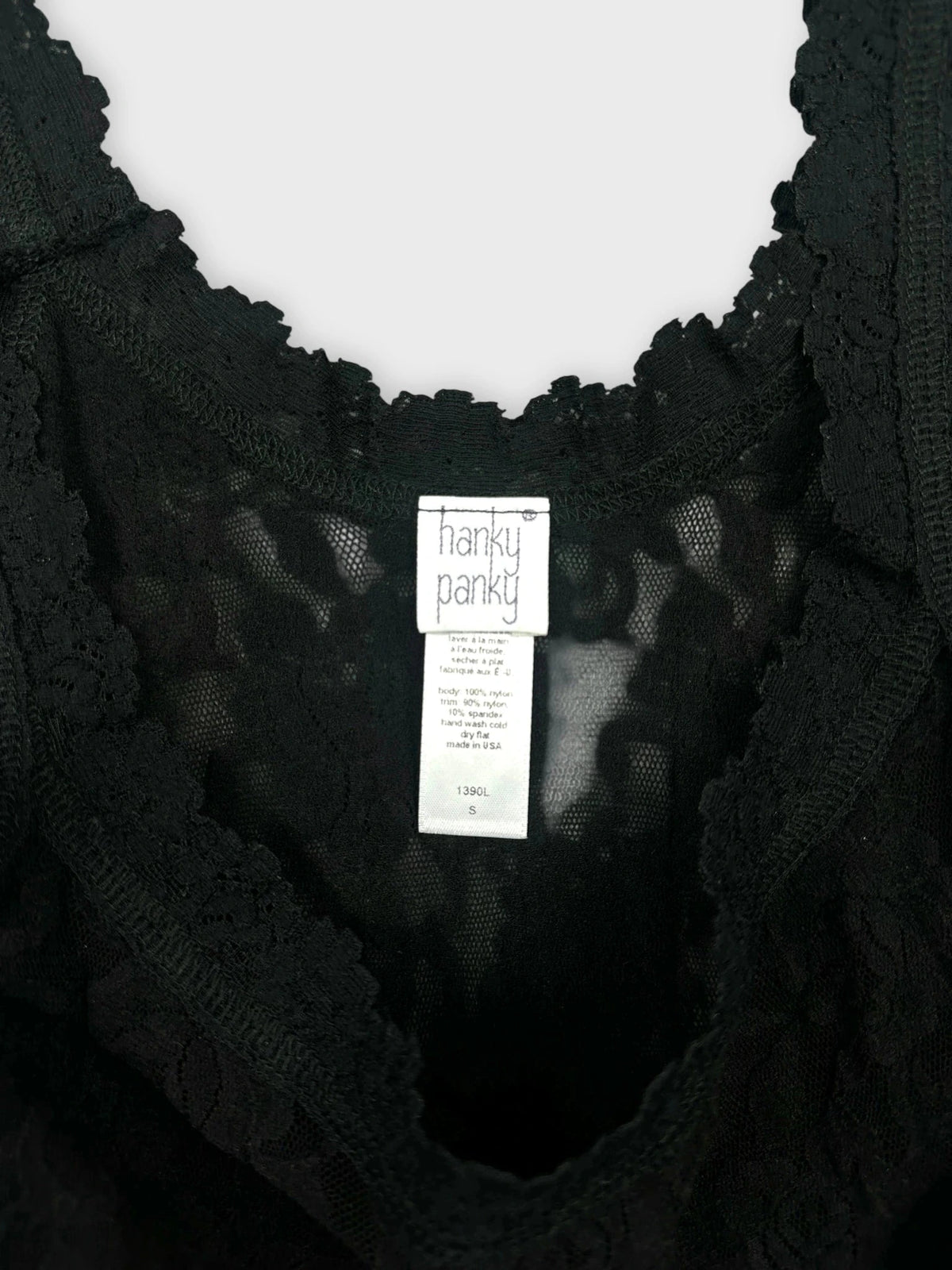 Black lace tank top with sheer detailing back view.