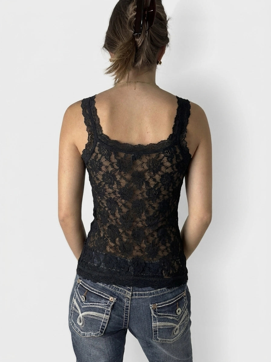 Back view of a black lace tank top showcasing sheer detailing.