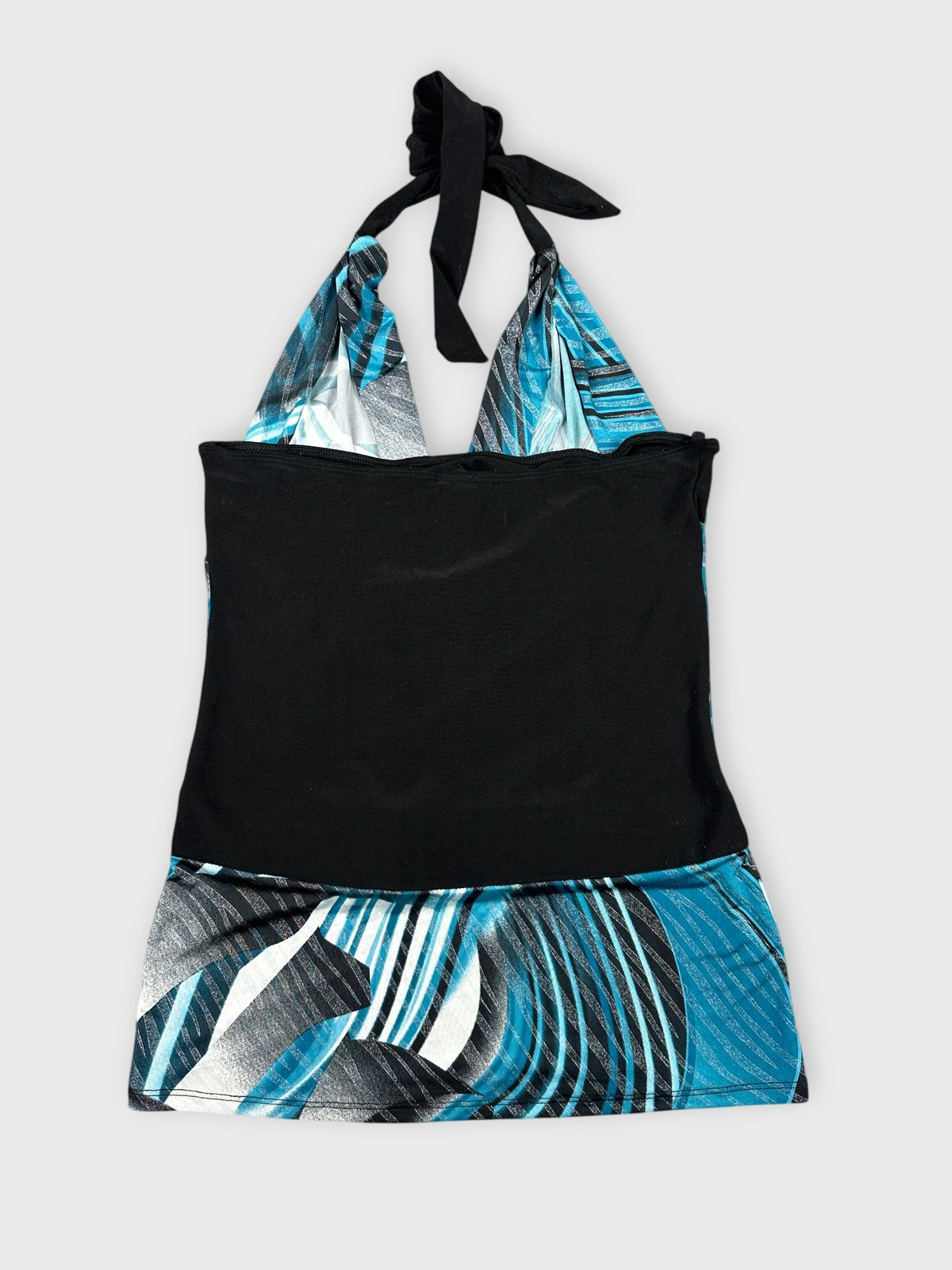 Back view of a halter top featuring a blue graphic print and black trim.