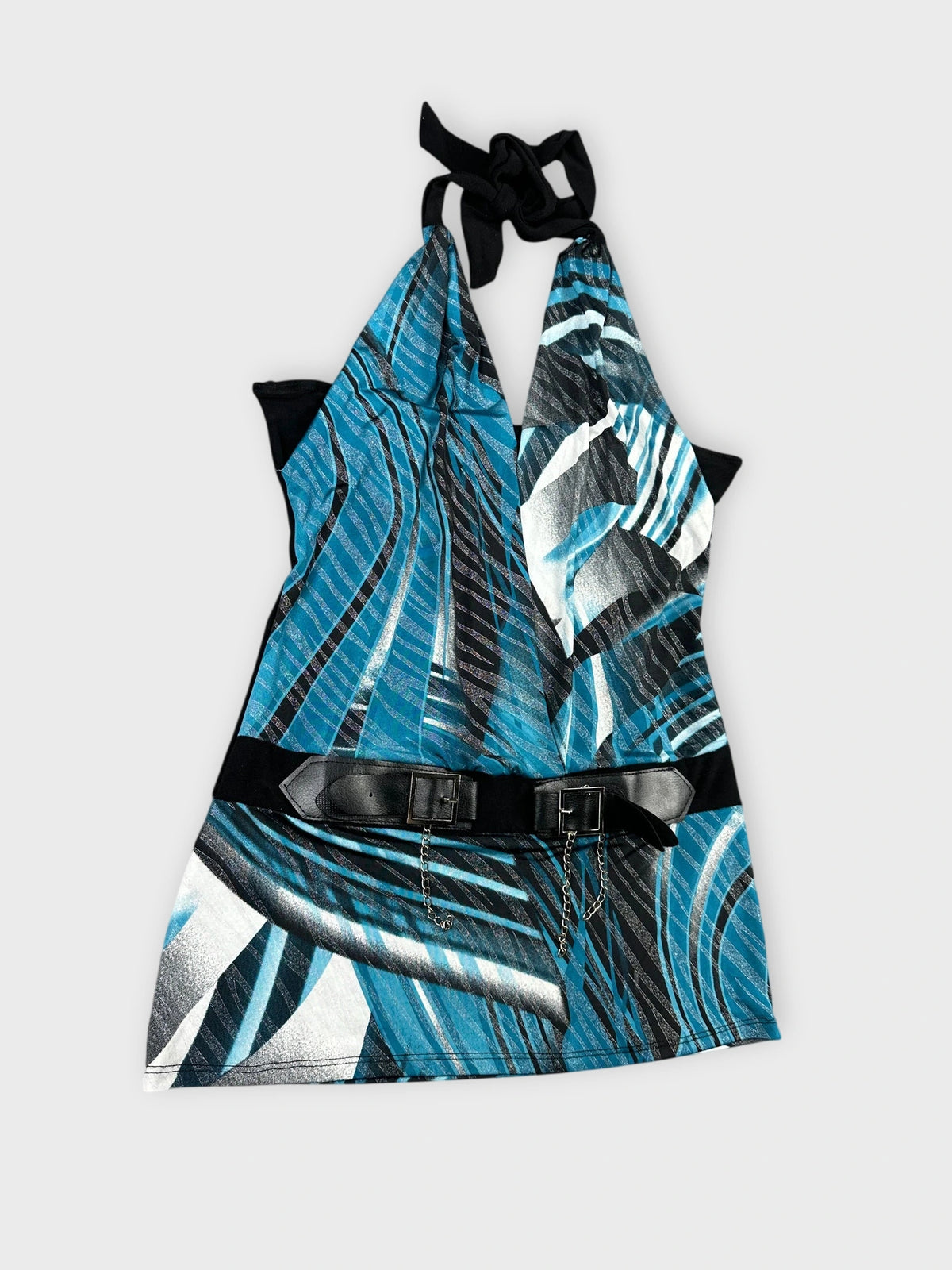 Detail view of blue halter top with graphic print and leather belt.