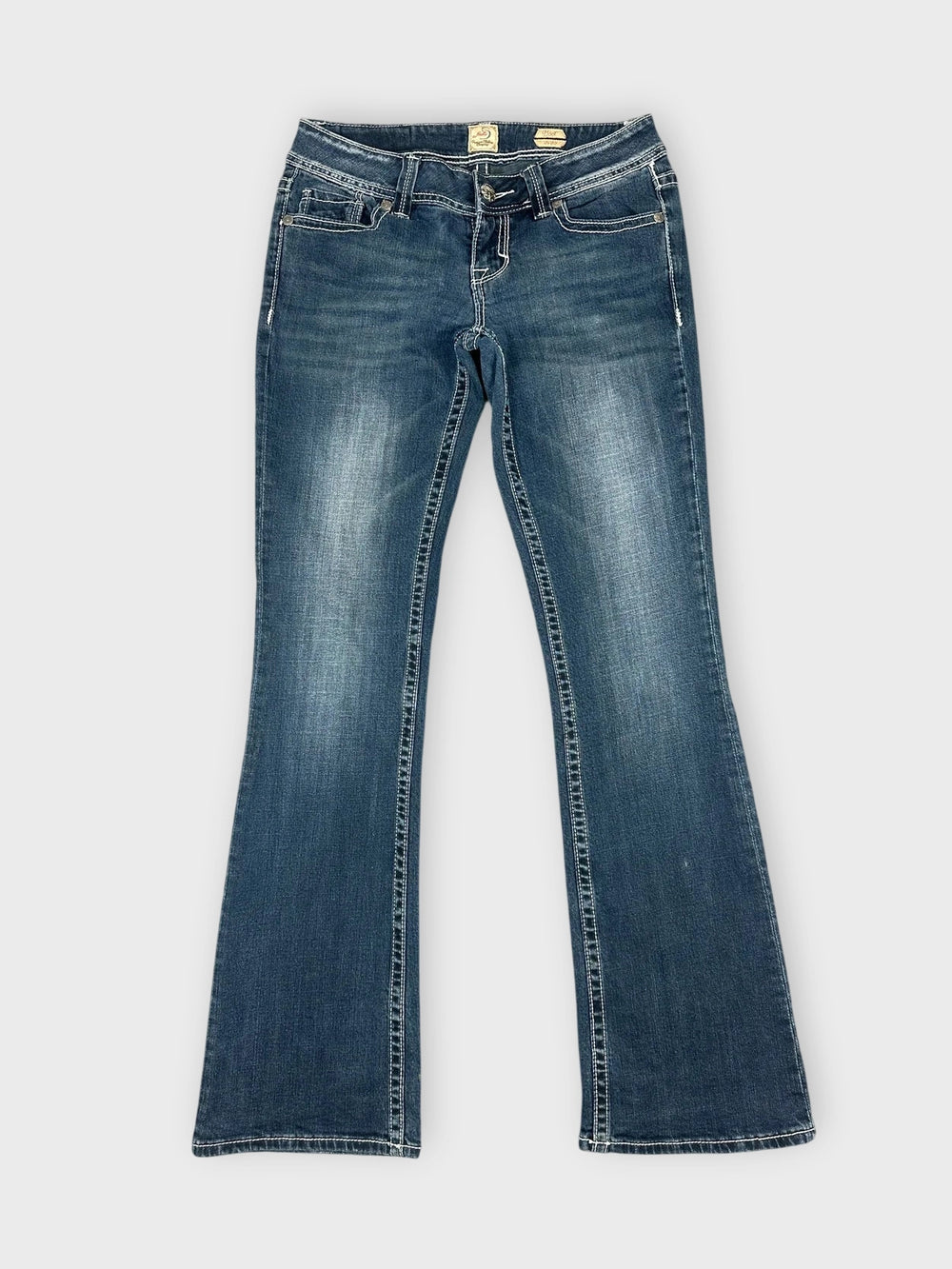Front view of dark wash denim flared jeans with classic pockets.