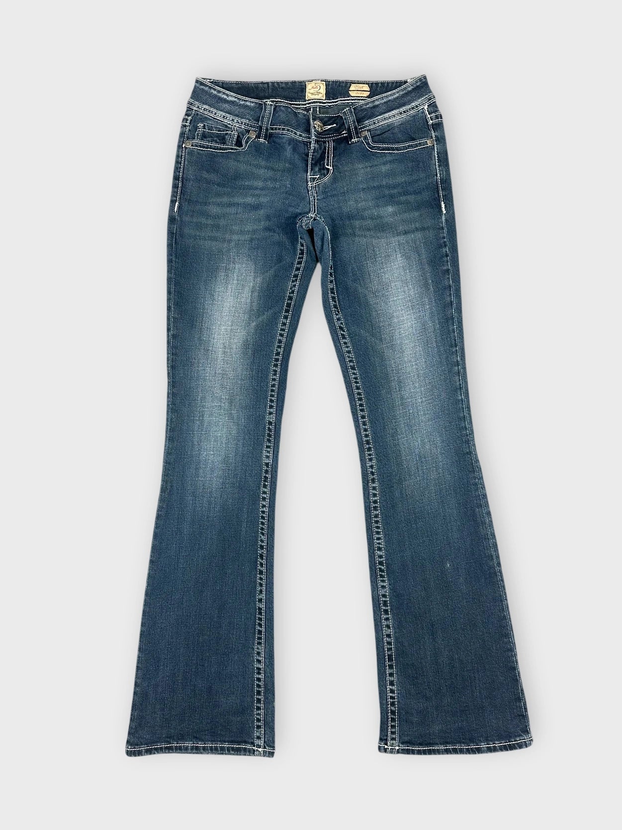 Front view of dark wash denim flared jeans with classic pockets.