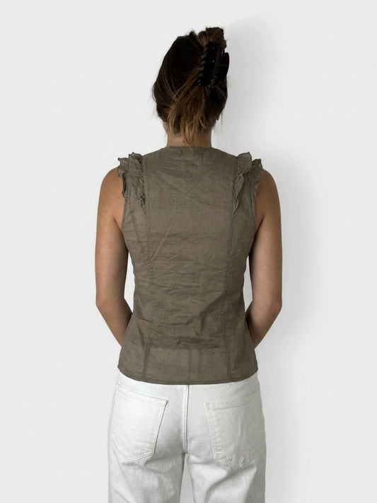 Back view of an olive green ruffle zip top with gathered detailing.