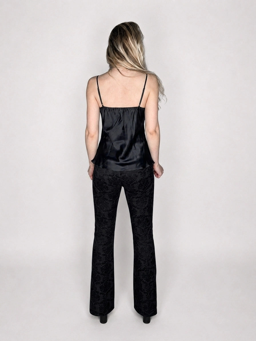 Back view of black silk camisole with lace detail.