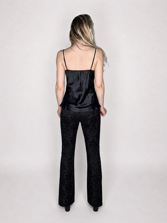 Back view of black silk camisole with lace detail.