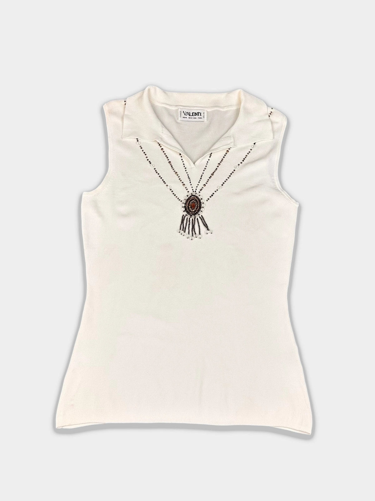 Elegant sleeveless top in cream with beaded details front view